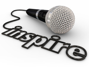 Inspire word in microphone cord to illustrate a keynote, motivational or self-help speaker sharing inspiration with a crowd or audience